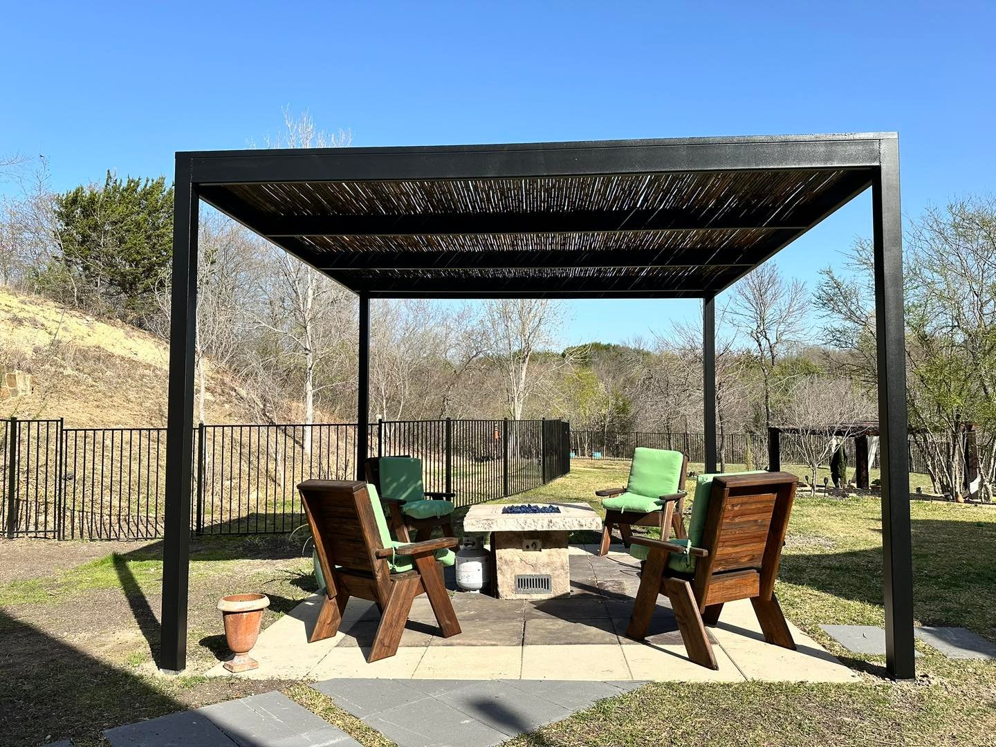 outdoor living area with covered patio and outdoor fireplace